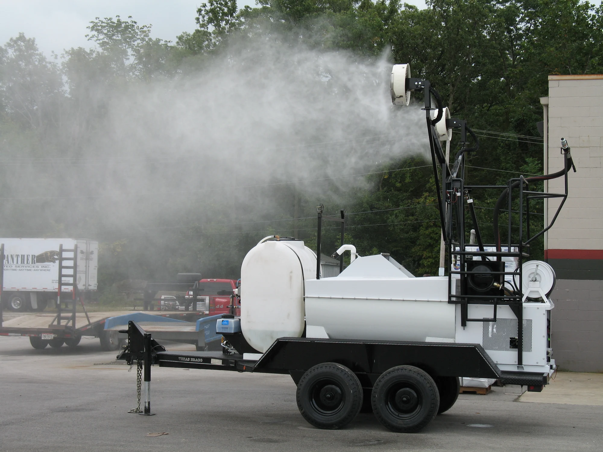 SWAT odor-control vehicle with rotary fan heads operating.